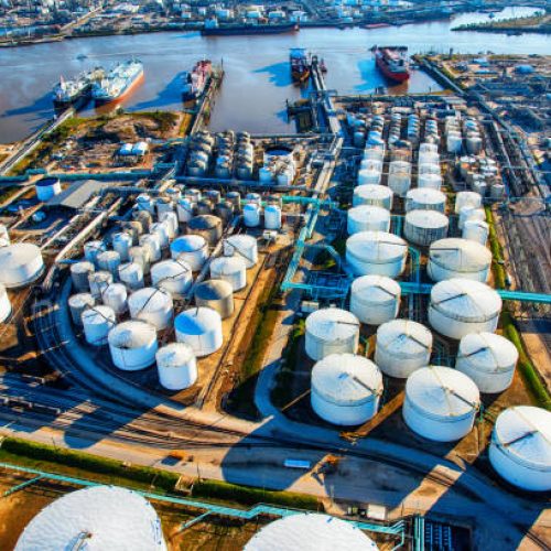A group of large sea baring oil tankers moored at a Texas oil refinery near Trinity Bay just outside of Houston, Texas, loading oil for export throughout the world.